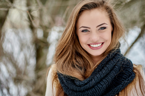 woman-smiling-in-the-snow